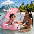 Baby Flotteur MamboBaby rose avec pare-soleil, bébé souriant dans l'eau à Tahiti